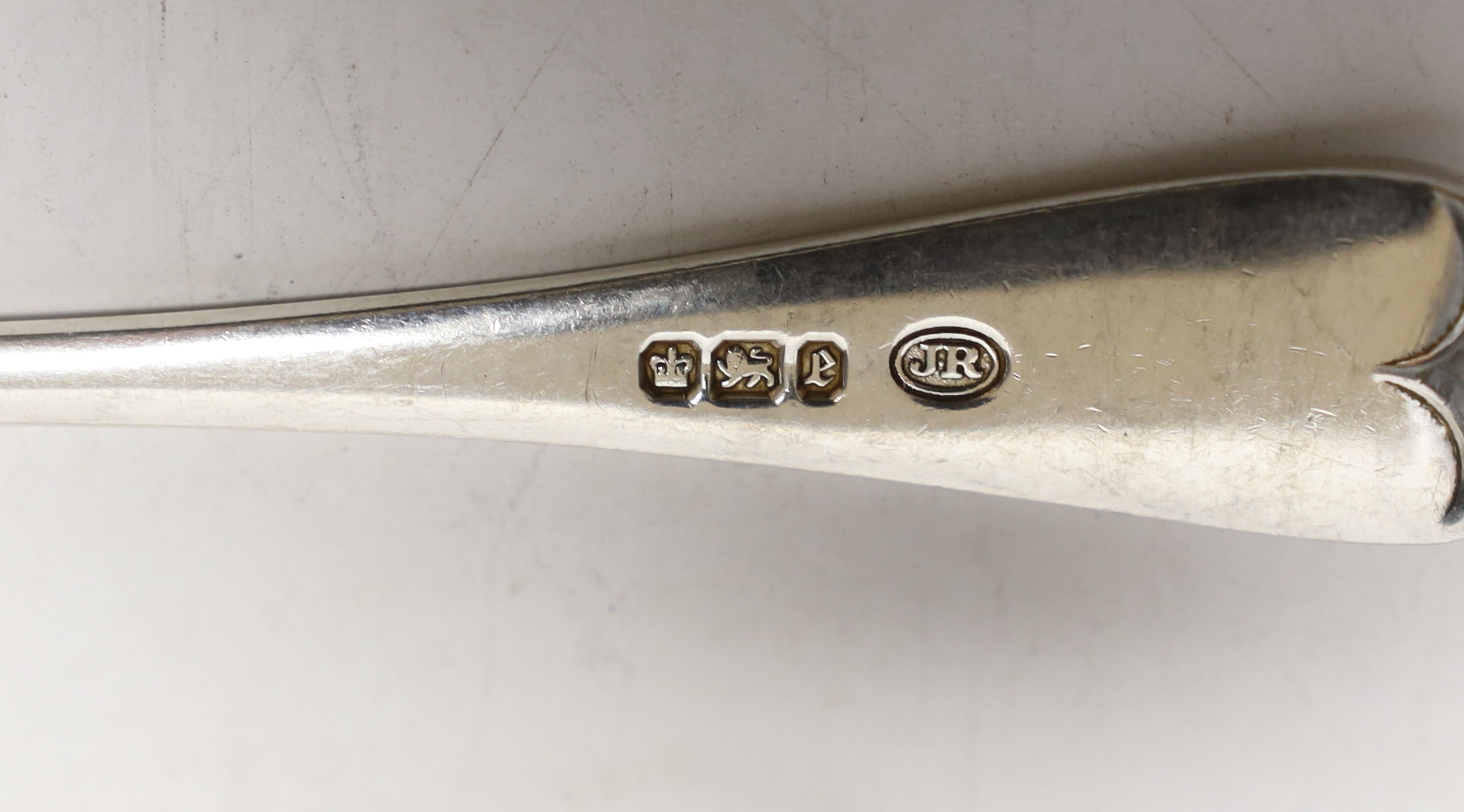 Eleven Gorge V silver Old English pattern dessert spoons, Goldsmiths & Silversmiths Co Ltd, London, 1930 and seven other silver dessert spoons, 29oz.